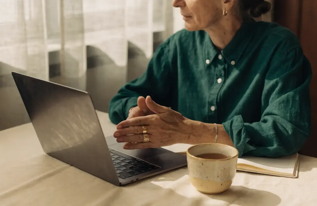 A member of our support team chatting at a laptop