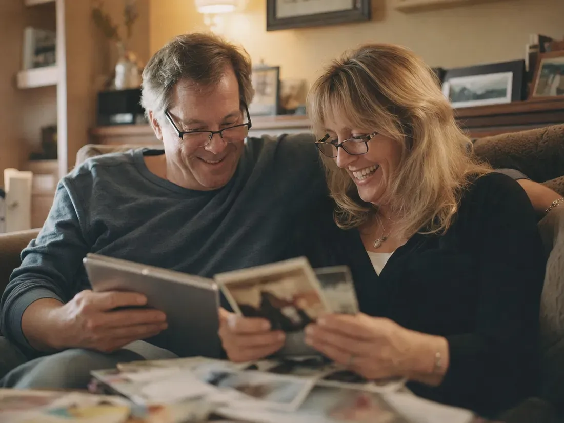 A couple leafs through old memories together on their anniversary