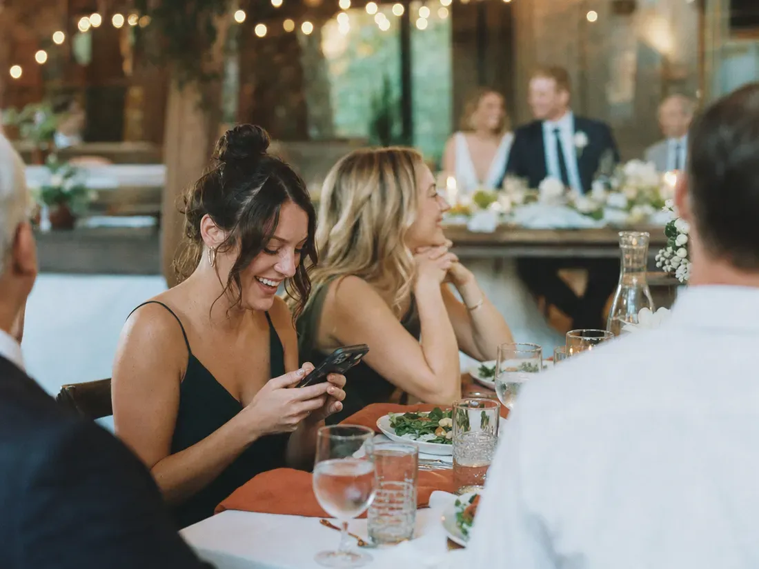 Wedding guests add wishes and stories from the table