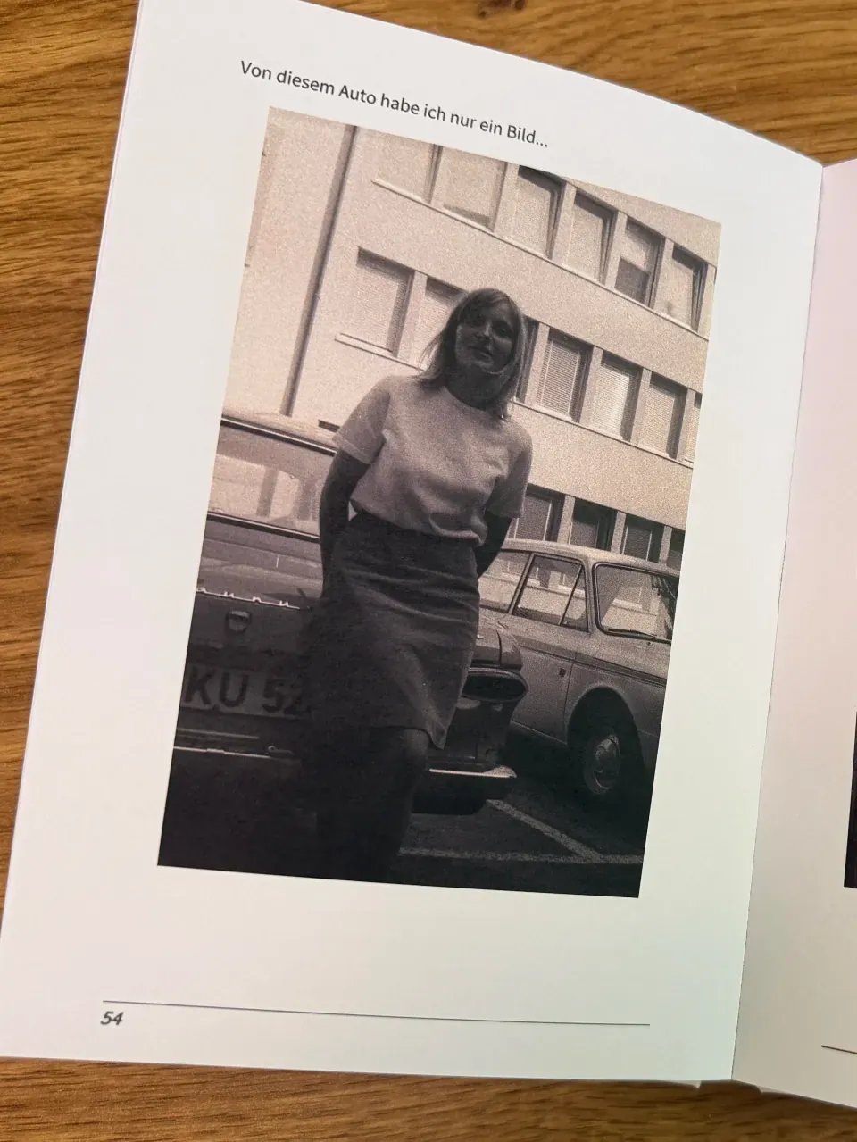 A real Meminto book page with a personal memory and a historic photograph