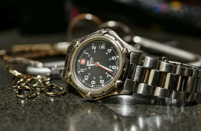 Classic wristwatch with a black dial and a stainless steel bracelet