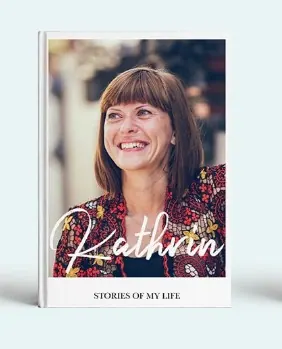 Memory book cover showing a smiling woman under the words Stories of my life