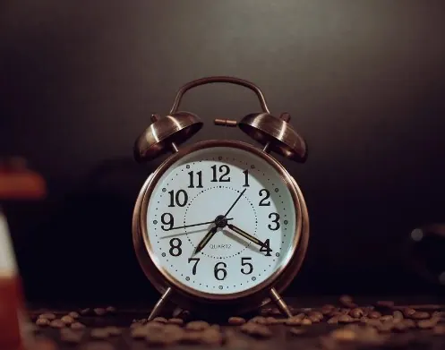 Vintage twin bell alarm clock with a brass finish