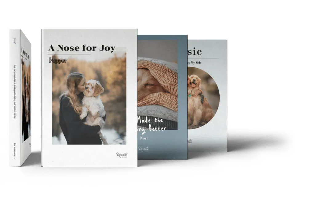 Four dog memory book covers standing side by side, each showing a photo of a dog