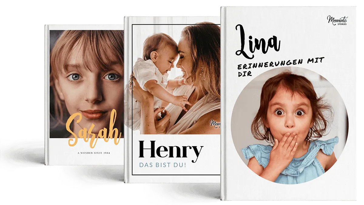 Three Meminto childhood books standing side by side, each with a child's photo on the cover