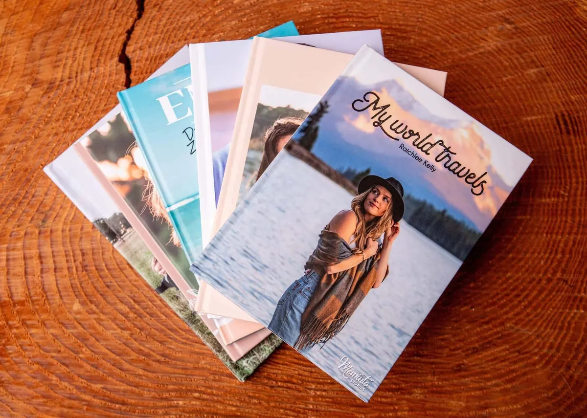 Fanned-out Meminto memory books with matte 5.8 × 8.3-inch hardcovers