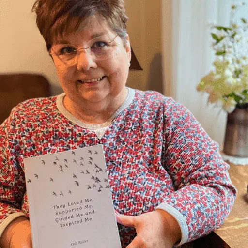 Gail with their own Meminto book