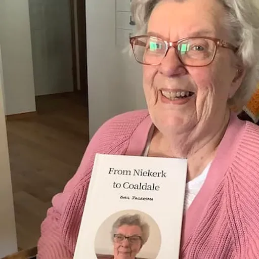 Gail with their own Meminto book
