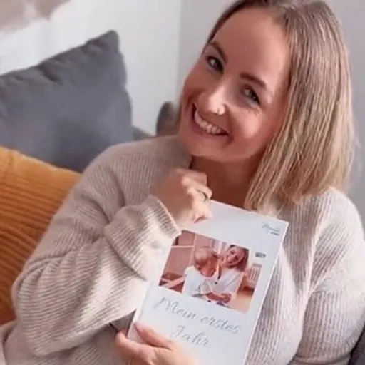 Ina with their own Meminto book